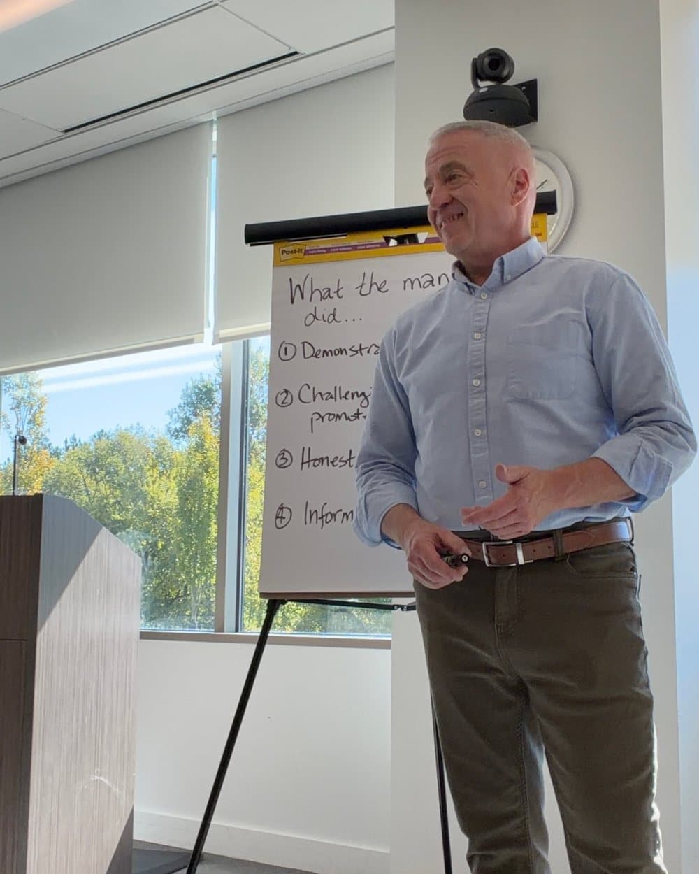 Shawn Devine facilitating a working session at a flip chart